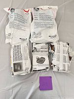 Five sealed 3M respirator kit packages on table