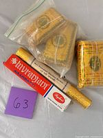 Lot overview showing boxed Shivranjani, rolled Sai Ranjani, and gold-wrapped packs in bag