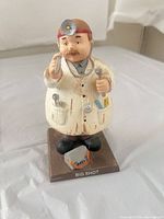 Front view of doctor bobblehead on base