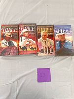 Front view showing all four sealed VHS volumes