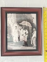 Front view of framed photograph showing image, frame colour and size scale