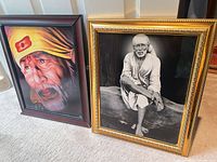 Both framed Sai Baba prints side by side