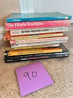 Stack of 10 paperbacks side view showing general condition