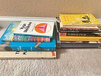 Both stacks showing all 11 paperback books