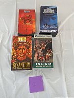 Front view of all four VHS tapes in slipcases