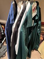 Six dress shirts hanging, various colors visible