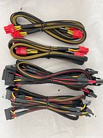 Four braided modular PSU cables showing different connector types