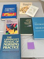 All seven books laid out on table