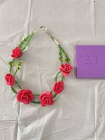 Full view of necklace showing bead arrangement and clasp