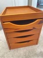 Front view of honey plywood 4-drawer organizer