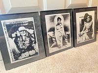 Three framed black-and-white Sai Baba portrait prints standing side by side