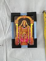 Front view showing entire framed Hindu deity print plaque