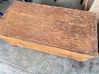 Top view of wooden lid showing grain and wear