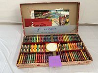 Open Rainbow Crayon Coloring Set showing box, crayons, palette and sheets