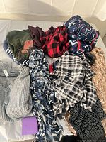 Pile view showing multiple garments and patterns