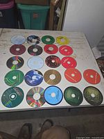 All 20 CDs laid out on table showing label sides
