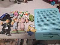 Group shot of all items: figurines, toy car, peg board