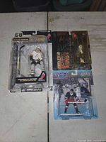 All three sealed action figures grouped together