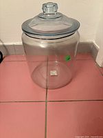 Full view of glass jar with lid seated