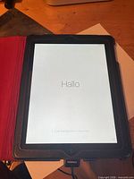 iPad front powered on showing setup screen within folio case
