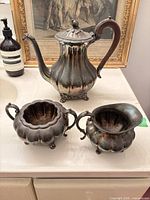 Teapot, sugar bowl, creamer on counter