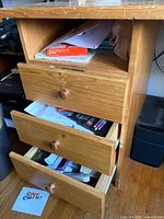 Front view showing three drawers and knee space