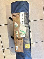 Full view of tent carry bag showing label