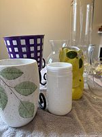 Group shot showing all containers and wrought iron stand