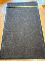 Top view of entire rug with measuring tape across width