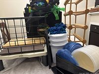 Group shot showing wooden wine rack, black wire crate, Fellowes riser base, reusable bags, plastic lids in holder