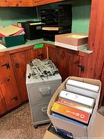 Full view of filing cabinet with accessories surrounding it