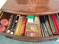 Drawer view showing all assorted candles and glass holders