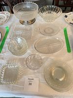 Group shot of all nine pressed glass pieces