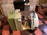 Group shot showing Boekamp heater, two box fans, tabletop fan