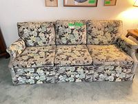 Full view of the three-seat floral sofa