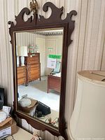 Full view of Federal style mahogany wall mirror mounted on wall