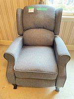 Front view of gray wingback recliner chair