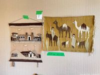 Both tapestries hanging on wall showing full designs and scale