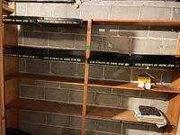 Overall view of four trays mounted on shelving