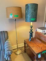 Floor and table lamps side by side showing full height and shades