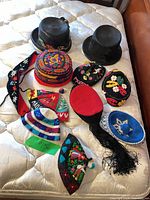 Group shot showing all nine hats on mattress