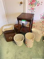 Group shot showing side table and six wastebaskets
