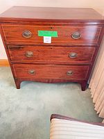 Front view of mahogany dresser with three drawers