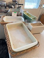 Baking dishes and loaf pans stacked on counter