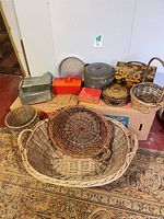 Group view of all baskets, metal pot, tins and boxes