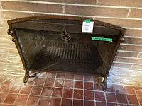Full view of fireplace screen and grate with dimension tag visible