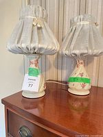 pair of ceramic floral lamps on dresser