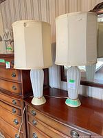 Pair of lamps side by side showing full form, shades, and overall condition