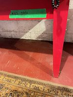 Close-up of leg and underside apron with wear