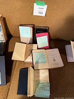 Overview of four religious books opened and stacked on couch